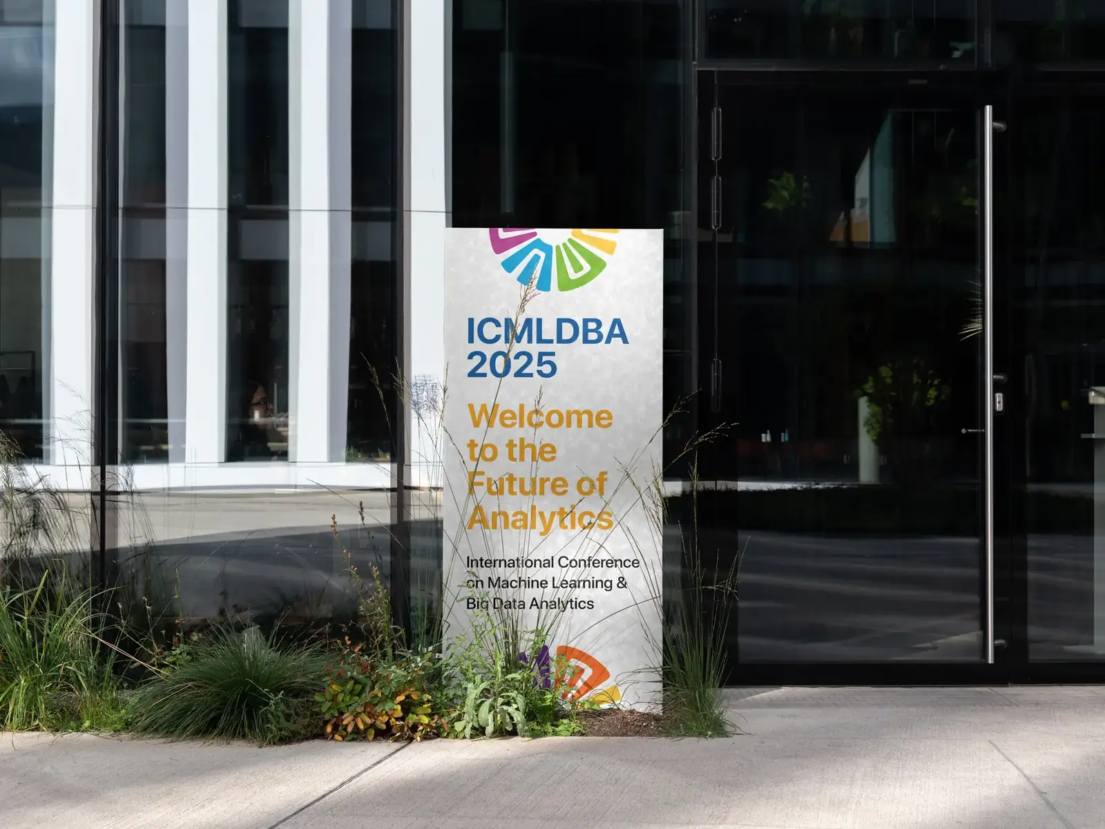 ICMLDBA 2025 welcome standee outside a building