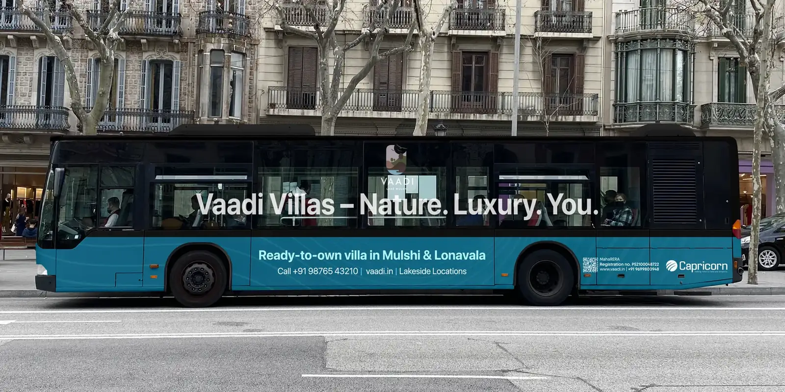 Vaadi Villas ad on the side of a city bus